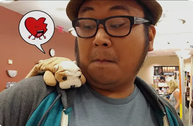 Justin Castaneda with dog plushie on his shoulder