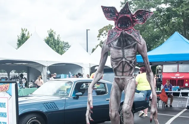 8 foot animatronic Demogorgon next to car